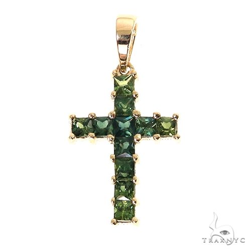 Yellow gold cross pendant with deep green princess cut gemstones