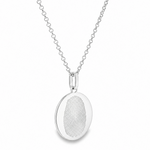 Silver oval pendant with fingerprint engraving on a delicate chain necklace.