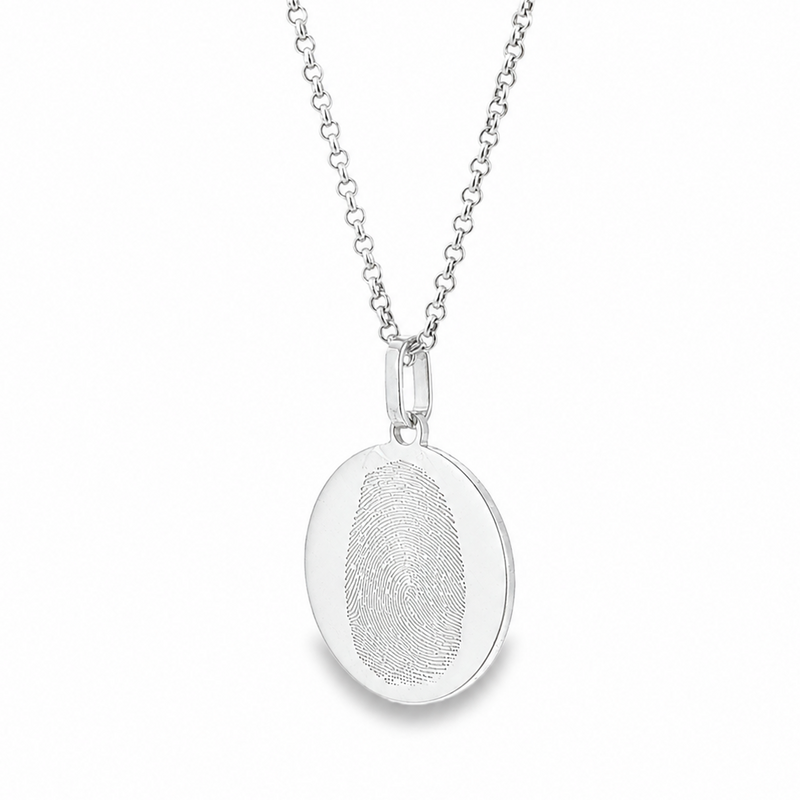Silver oval pendant necklace with detailed fingerprint engraving on fine chain.