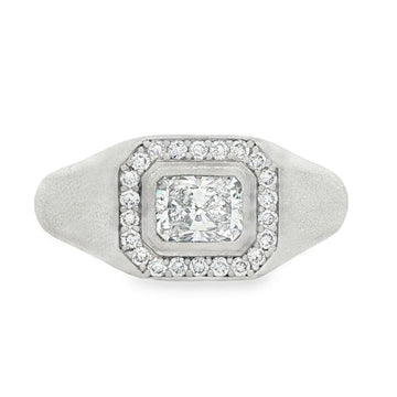 Men's silver ring with rectangular center diamond surrounded by smaller diamonds.