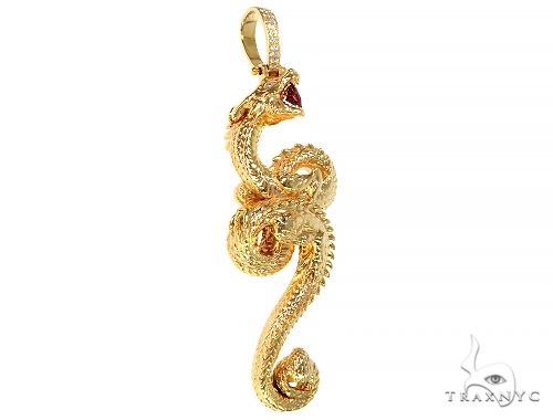 Intricately detailed 3D yellow gold dragon pendant with textured scales and ruby eyes