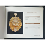 Gold lion head pendant with sparkling diamonds and detailed mane texture.