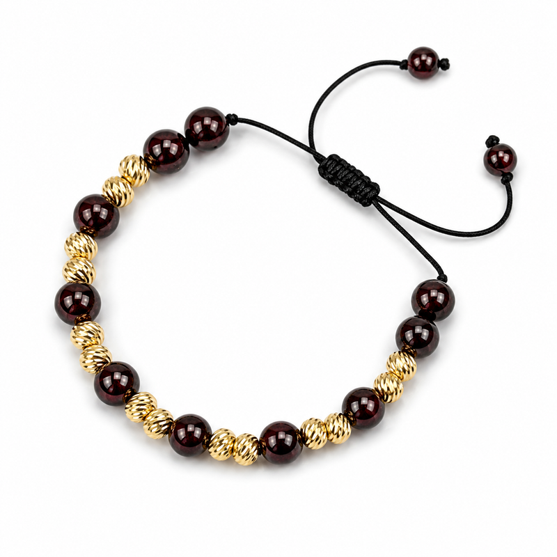 Adjustable natural red garnet bead bracelet with textured 14K gold beads and a black sliding cord.