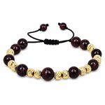 Adjustable natural red garnet bead bracelet with textured 14K gold beads and a black sliding cord.