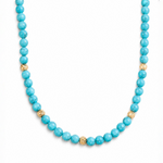 Turquoise gemstone necklace with textured gold beads, 22-inch length, polished round beads.