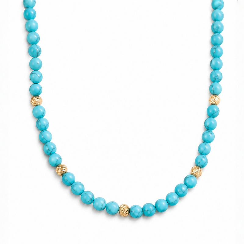Turquoise gemstone necklace with textured gold beads, 22-inch length, polished round beads.