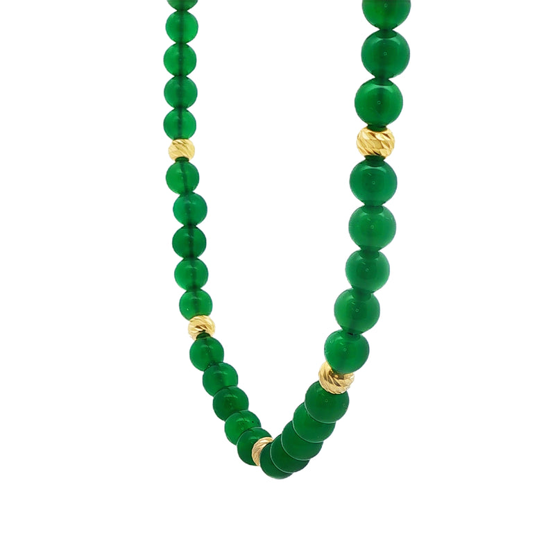 Necklace with round green gemstones interspersed with textured gold beads.