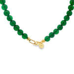 Green gemstone beads necklace with gold clasp and round gold bead accents.