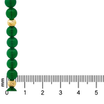 Green agate gemstone necklace with textured gold beads, displayed with millimeter ruler for size.