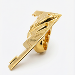 Gold four-finger ring shaped like a B-2 bomber with detailed wing and fuselage design.