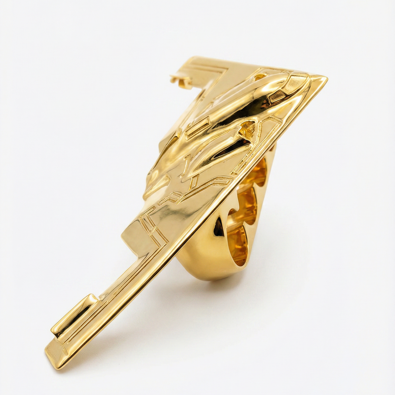 Gold four-finger ring shaped like a B-2 bomber with detailed wing and fuselage design.