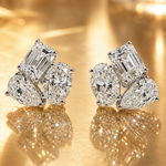 White gold Harmony Trio stud earrings with emerald, oval, and pear-shaped diamonds cluster.