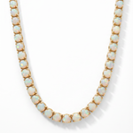 Yellow gold opal tennis chain with round opal gemstones in classic setting.