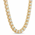 Yellow gold tennis chain with round opal gemstones in secure prong settings.