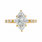 2 Ct marquise diamond engagement ring with gold band and side diamonds.
