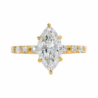 2 Ct marquise diamond engagement ring with gold band and side diamonds.