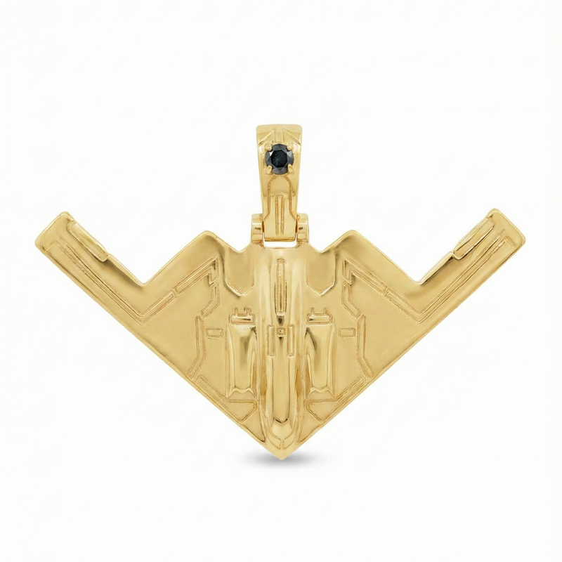 14k gold B-2 bomber pendant with black diamond accent and detailed aircraft design.
