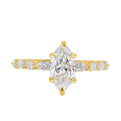 1 ct marquise diamond ring with gold band and round diamond accents.