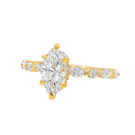 1 Ct marquise diamond engagement ring with gold band and side round diamonds.