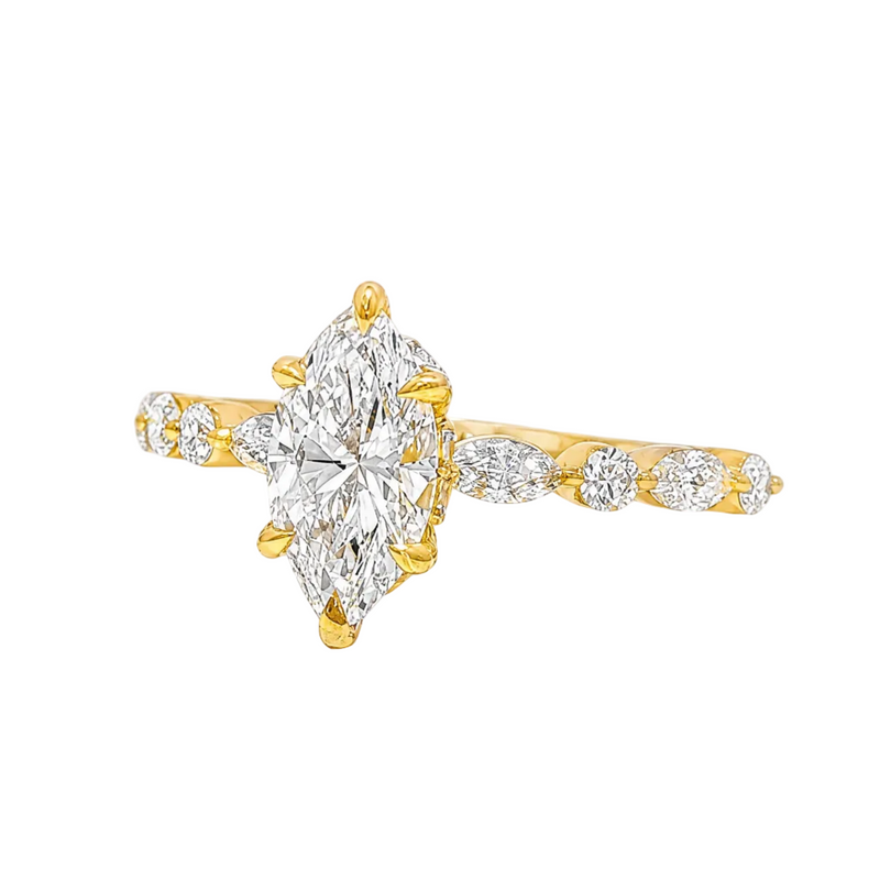 1 Ct marquise diamond engagement ring with gold band and side round diamonds.