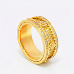 Gold mechanical spinner ring with rows of small sparkling diamonds, bold men's design.