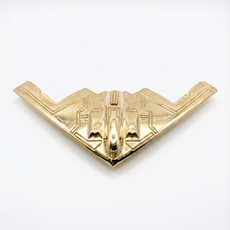 Gold B-2 Bomber shaped ring with four-finger design and sleek polished finish.