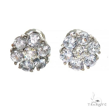 White gold flower cluster earrings with sapphire and diamond gemstones.
