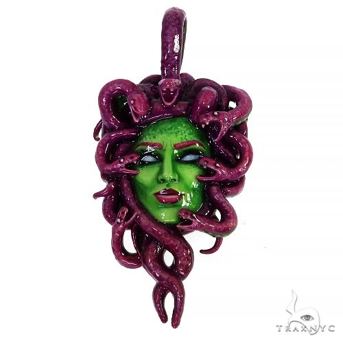 Silver glow-in-the-dark Medusa pendant showing serpent hair detail and enamel face, front view