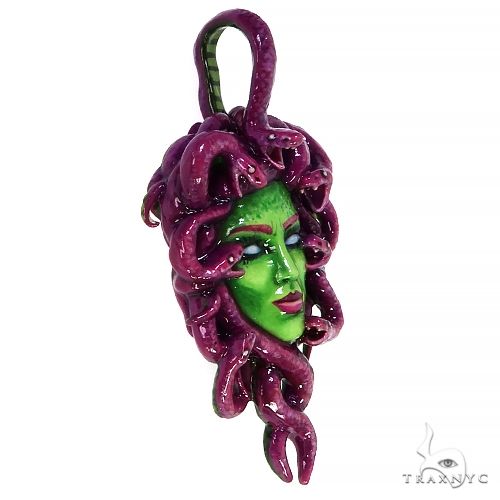 Silver pendant with glowing green Medusa face and purple snake hair details