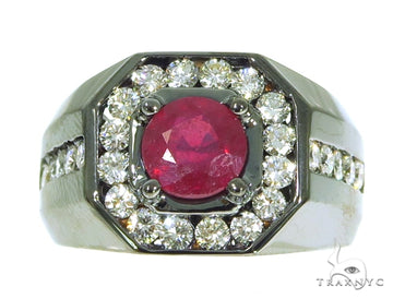 Men's white gold ring with central ruby surrounded by diamonds on wide band.