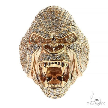 Yellow gold gorilla head ring encrusted with diamonds, detailed facial features, open mouth design.