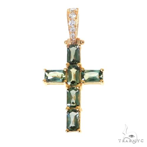 Yellow gold cross pendant with rectangular green sapphire gemstones and diamond bail