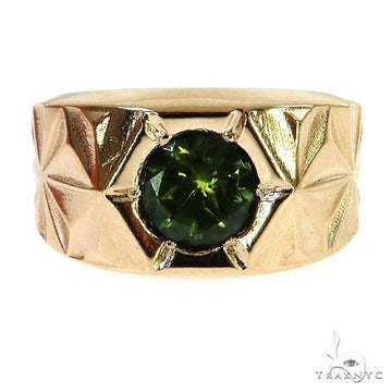 Yellow gold ring with round green tourmaline and geometric textured band.
