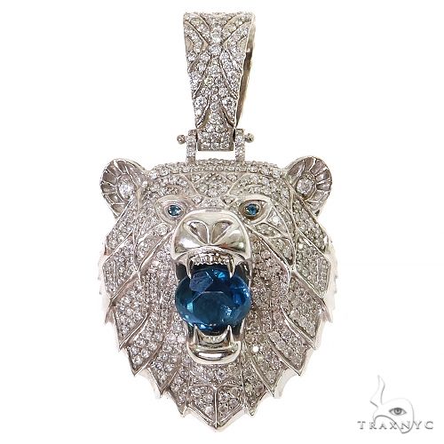 White gold grizzly bear pendant with blue topaz gemstone and diamond accents
