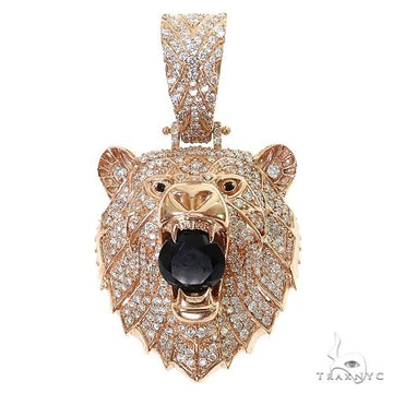 Rose gold bear pendant with diamond accents and a central black onyx gemstone.