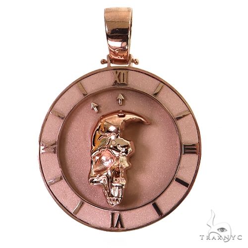 Rose gold half skull pendant with Roman numeral clock face detail