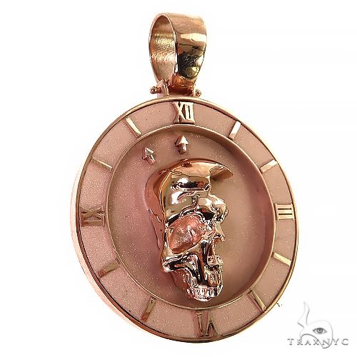 Rose gold pendant with half skull design and Roman numeral clock face accents