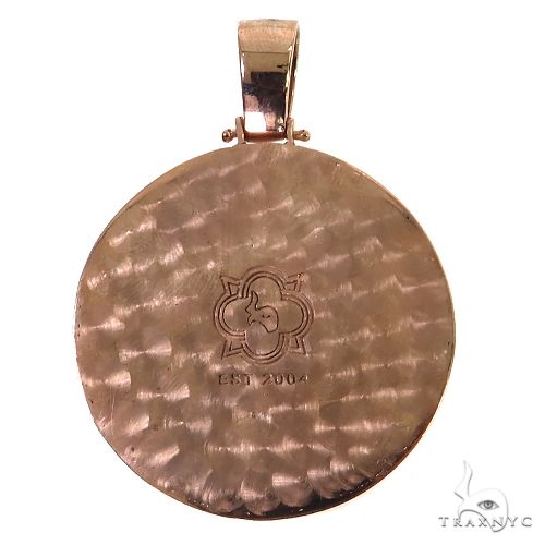 Round hammered gold pendant with half skull logo engraved in center