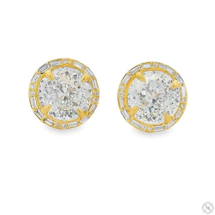 White gold halo stud earrings with Portuguese cut diamonds and small surrounding diamonds.