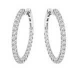 Silver diamond inside-out hoop earrings with sparkling round-cut stones.