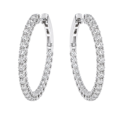 Silver diamond inside-out hoop earrings with sparkling round-cut stones.