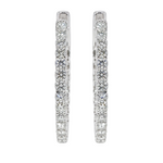 White gold inside-out diamond hoop earrings with channel-set sparkling diamonds.