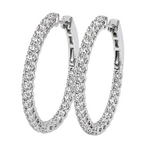 Silver hoop earrings encrusted with sparkling diamonds on both inner and outer edges.
