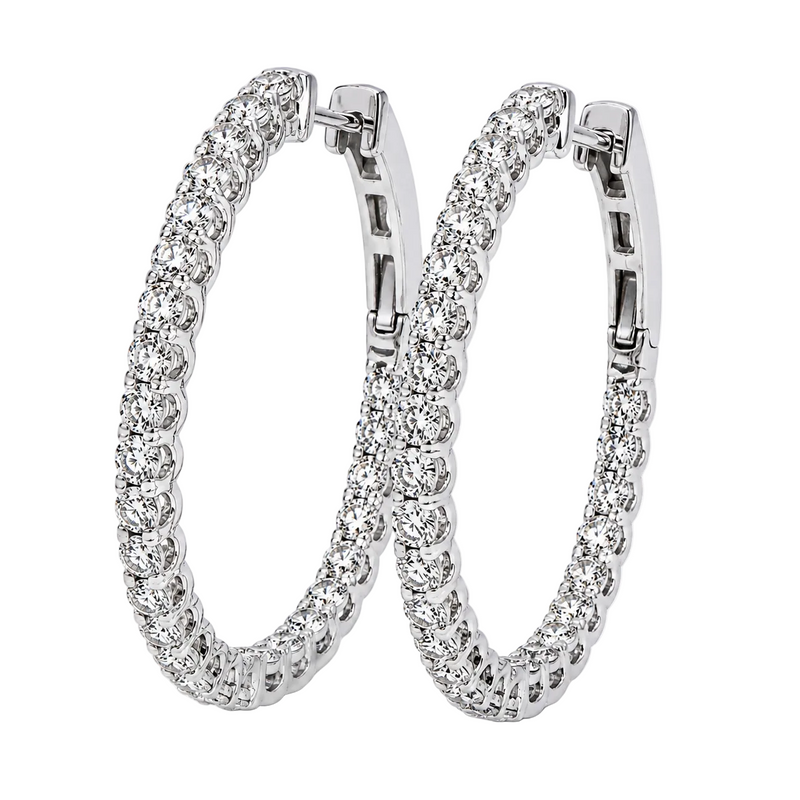 Silver hoop earrings encrusted with sparkling diamonds on both inner and outer edges.