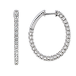 Silver diamond inside-out hoop earrings with sparkling round-cut stones.