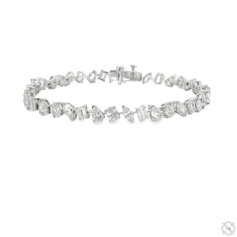 White gold bracelet with alternating round and baguette diamonds in geometric shapes