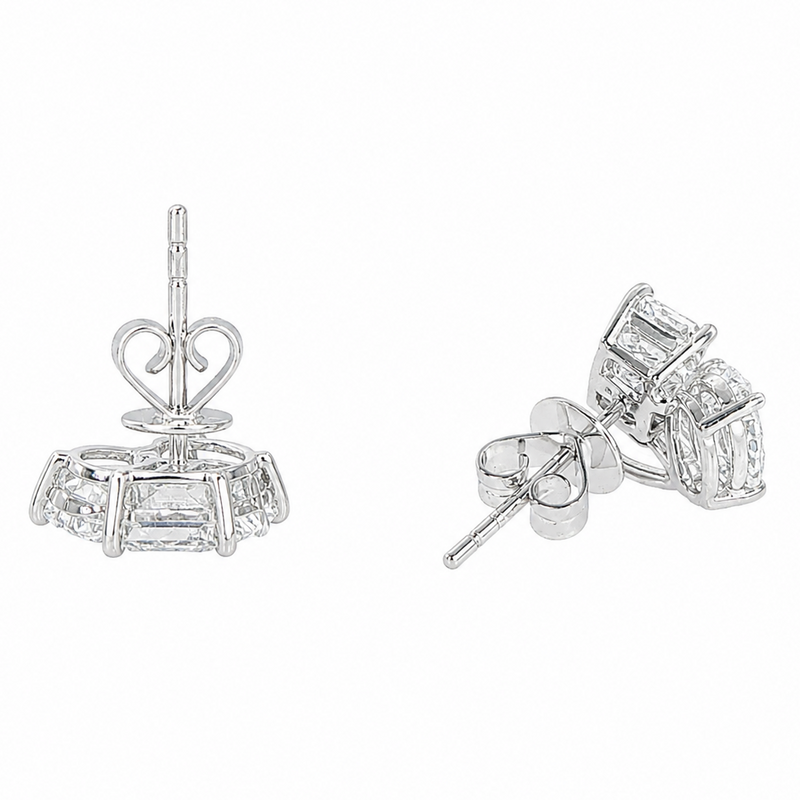 White gold stud earrings with trio cluster baguette and round diamonds, heart-shaped backs