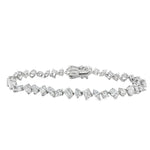 White gold bracelet with alternating round and square diamonds in geometric design.