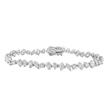 White gold bracelet with alternating round and square diamonds in geometric design.