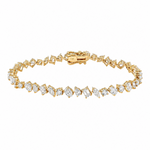 Yellow gold bracelet with alternating square and round diamonds in geometric design.